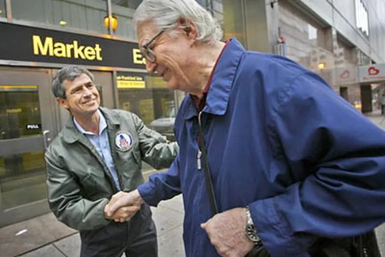 Rep. Joe Sestak greets Jim Shaw of New Jersey outside the Market East SEPTA station on Wednesday morning. Shaw waited for the opportunity to greet Sestak, who beat Sen. Arlen Specter in Tuesday's Democratic primary. (Alejandro A. Alvarez / Staff Photographer)
