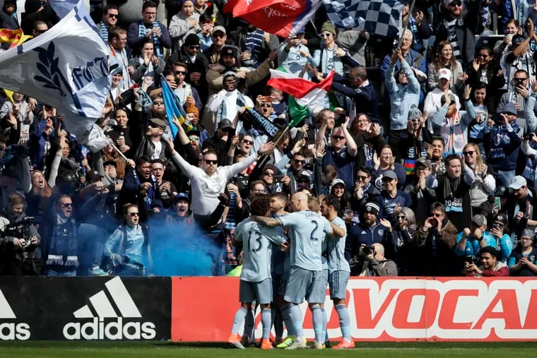 Sporting Kansas City players celebrate after Ilie Sánchez's first half penalty kick gave their team the lead against the Philadelphia Union.