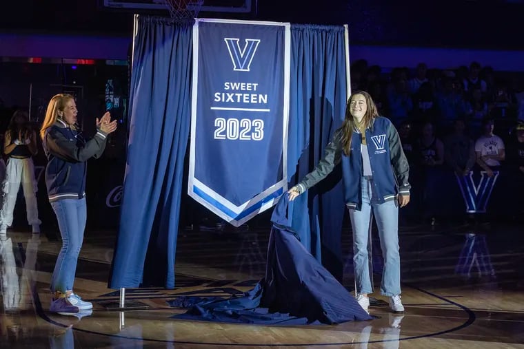 Maddy Siegrist (right), now in the WNBA, returned to campus on Oct. 21 to help head coach Denise Dillon unveil their Sweet Sixteen banner. A few days later, it was announced she would remain with the program as a special assistant.
