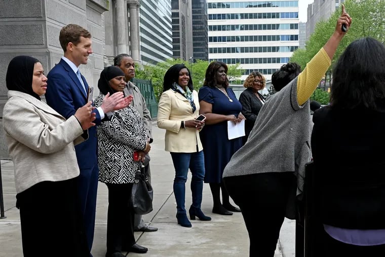 U.S. Rep. Conor Lamb, second from left, a Pennsylvania Democratic Senate candidate, outside Philadelphia City Hall on Wednesday as Darisha K. Parker, right, encourages abortion rights supporters to vote. They appeared at a National Organization for Women news conference in support of abortion access and Lamb's campaign.