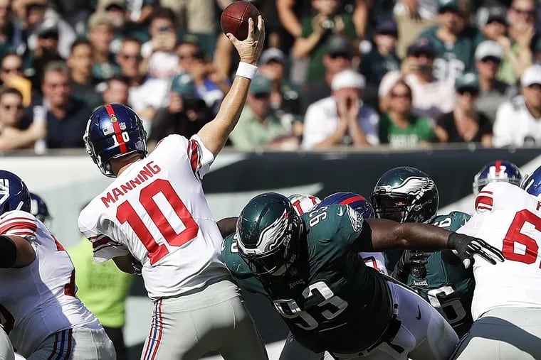 Eagles defensive tackle Timmy Jernigan goes after New York Giants quarterback Eli Manning.