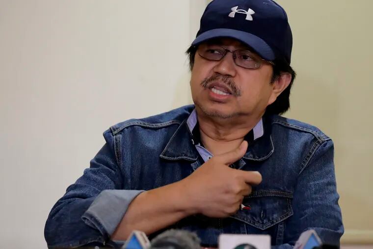 In this Sunday, March 24, 2019, photo, former Police Senior Superintendent Eduardo Acierto gestures during a clandestine news conference for the first time with a select group of journalists in Manila, Philippines. Acierto, who was assigned in various units of the police anti-illegal drugs for 18 years, is now in hiding after being included in President Rodrigo Duterte's so-called "matrix" list of persons allegedly involved in the illegal drug trade. (AP Photo/Bullit Marquez)
