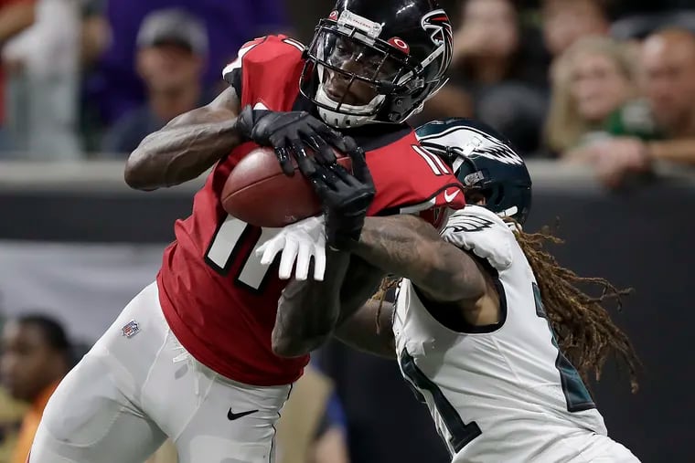 Atlanta Falcons wide receiver Julio Jones, left, catches a touchdown in front of Eagles cornerback Ronald Darby, in the third quarter.