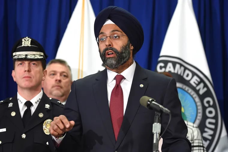 New Jersey Attorney General Gurbir Grewal (right) is joined by law enforcement officials Camden County Police Department Chief Scott Thomson (left) at press conference February 14, 2018 in Camden.