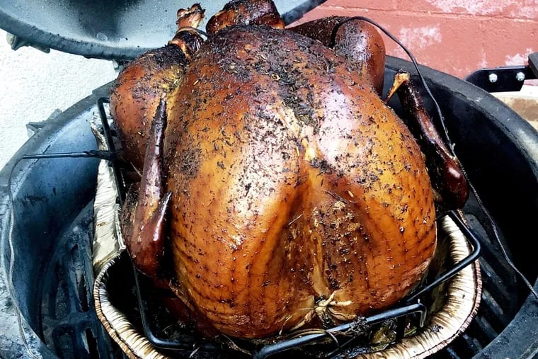 Craig LaBan's Thanskgiving turkey emerges from his smoker grill after roasting low and slow for five hours.
