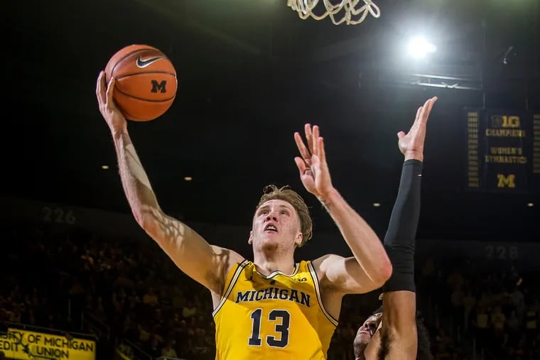 Michigan's Big Ten Conference Newcomer of the Year Ignas Brazdeikis (13) goes to the basketin the second half of a January 22 NCAA college basketball game in Ann Arbor, Mich.