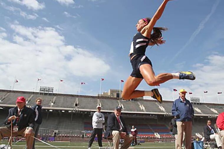 Ithaca senior Emma Dewart jumps during the College Women's Heptathlon. (Charles Fox/Staff Photographer)