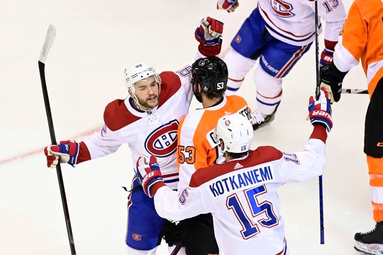 Did the Canadiens rub it in on Friday during their 5-0 win over the Flyers? Philadelphia coach Alain Vigneault thinks so. The Canadiens dominated play throughout and tried to pile on, Vigneault said. Here, Jesperi Kotkaniemi celebrates his first goal with teammate Jonathan Drouin, oblivious to Flyers defenseman Shayne Gostisbehere.