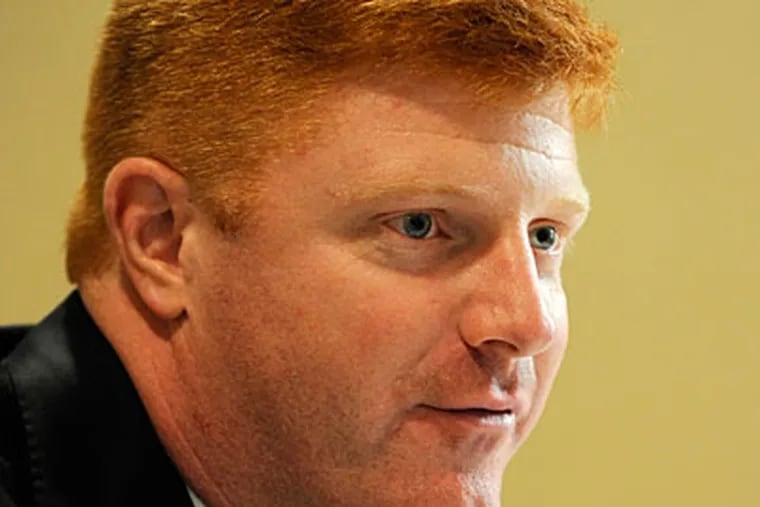 Penn State quarterbacks coach Mike McQueary, who has faced harsh criticism over what he did after he saw Jerry Sandusky allegedly raping a boy in the PSU locker room.