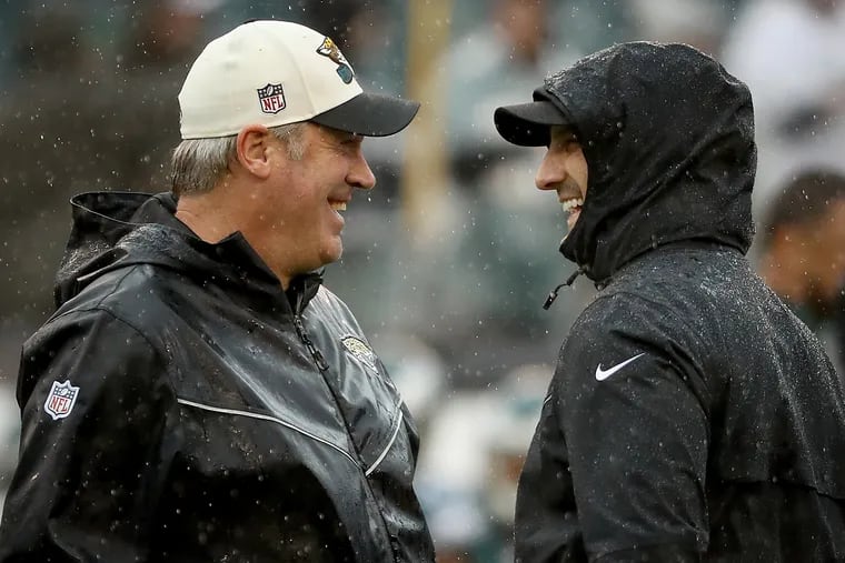 Jacksonville Jaguars head coach Doug Pederson and Eagles head coach Nick Sirianni share a laugh before their game at Lincoln Financial Filed.