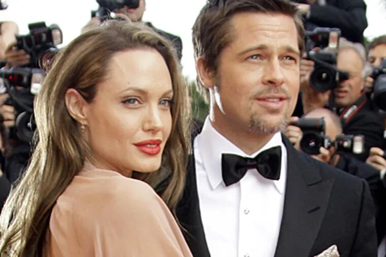 Celebrity gossip sites are buzzing over Angelina Jolie's comment that her 4-year-old daughter, Shiloh, wants to be a boy. Here, Jolie and Brad Pitt, arrive on the red carpet in Cannes, France in May, 2009. (AP Photo/Francois Mori, file)