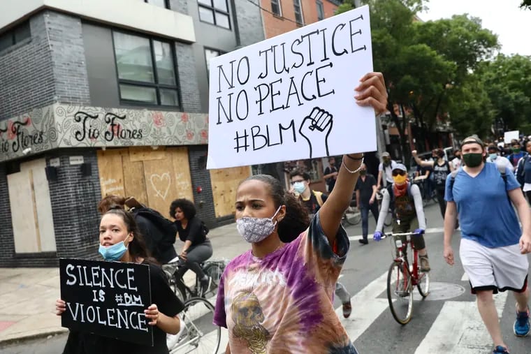 Thousands marched past restaurants along South Street in Philadelphia on June 2 to protest the death of George Floyd in custody of Minneapolis police.