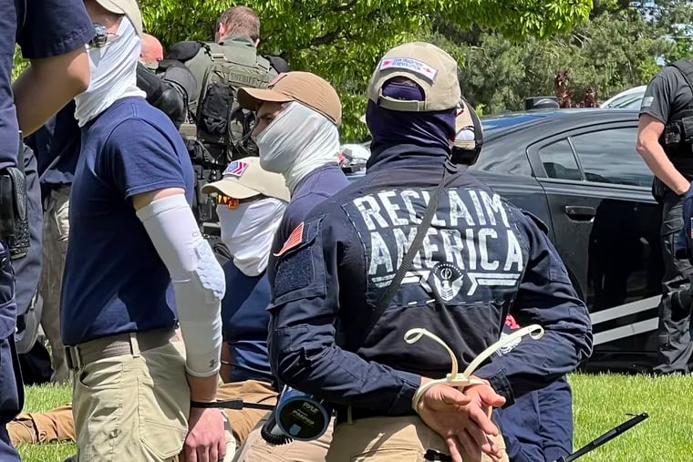 Authorities arrest members of the white supremacist group Patriot Front near an Idaho Pride event on June 11, 2022, after they were found packed into the back of a U-Haul truck with riot gear.
