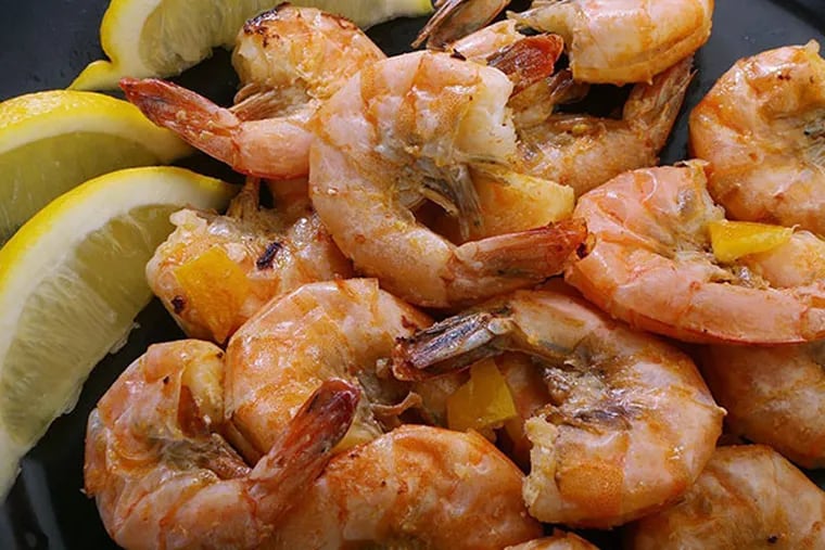 Cooked shrimp is sprinkled with preserved lemon. (J.B. Forbes/St. Louis Post-Dispatch/MCT)