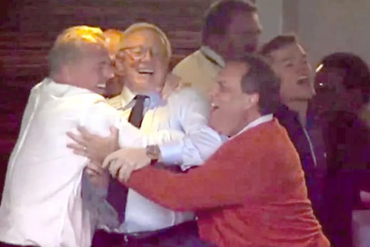 Jerry Jones (center) and son Stephen (left) celebrate a playoff touchdown against the Detroit Lions as Gov. Christie joins the hug at Sunday's game in Texas. Fox Sports