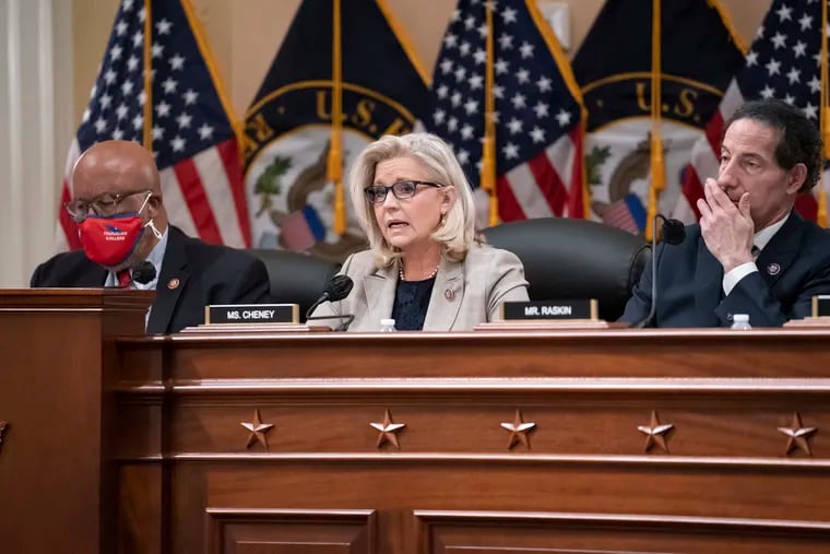 Rep. Liz Cheney (R., Wyo.), vice chair of the House panel investigating the Jan. 6 U.S. Capitol insurrection, is flanked by Chairman Bennie Thompson (D., Miss.) and Rep. Jamie Raskin (D., Md.) as they vote on pursuing contempt charges against former President Donald Trump's White House chief of staff Mark Meadows for not complying with a subpoena.