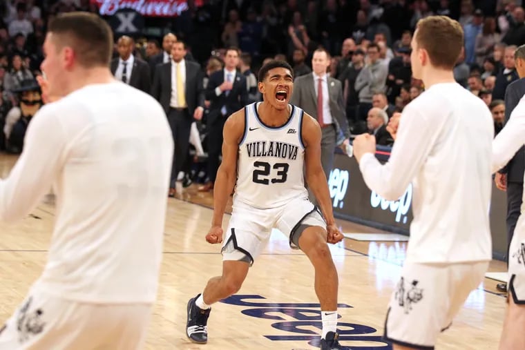Jermaine Samuels of Villanova celebratesas the bench runs out on the court after they defeated Xavier in overtime during a Big East Tournament semifinal game on March 15, 2019.