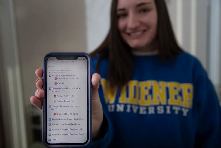 Widener student Michaela Kolenkiewicz shows a student portal app on her phone screen. She and two other students have worked together to develop a feature for Widener's student portal where students can type "breathe" in the search bar and a list of mental health services comes up.