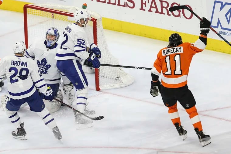 Travis Konecny, celebrating his goal against the  Maple Leafs last season, was at training camp Tuesday and should be ready to play in Saturday's exhibition game against the visiting New York Rangers.