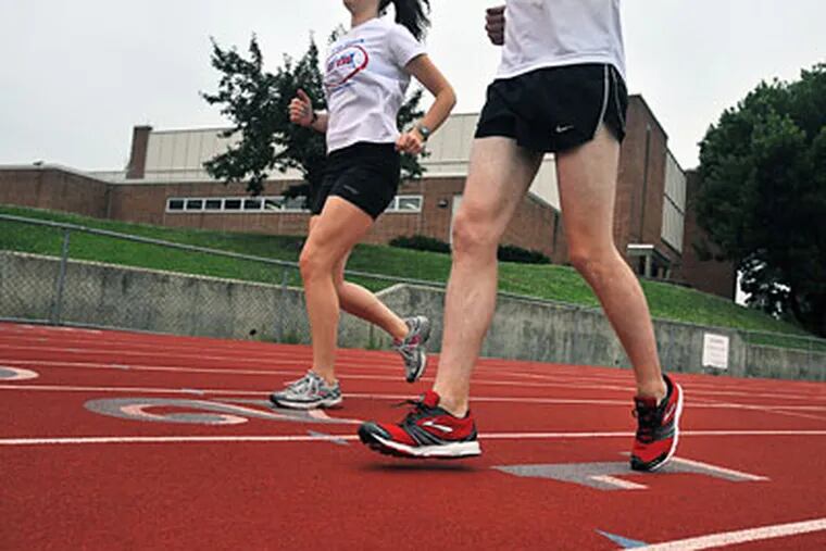 Jason Kilderry runs with shoes on, with Laura O'Mara as companion. (SHARON GEKOSKI-KIMMEL / Staff Photographer)