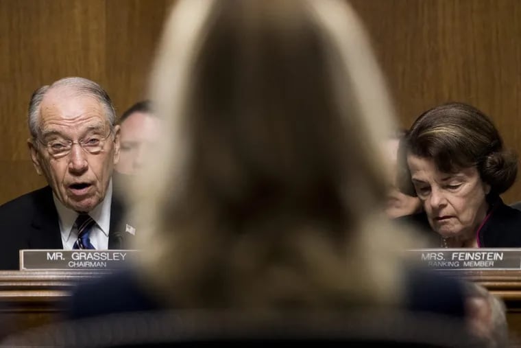 Chairman Chuck Grassley (R-Iowa) left, speaks to Dr. Christine Blasey Ford during the Senate Judiciary Committee hearing on the nomination of Brett M. Kavanaugh to be an associate justice of the Supreme Court of the United States, focusing on allegations of sexual assault by Kavanaugh against Christine Blasey Ford in the early 1980s. Sen. Dianne Feinstein (D-Calif.) listens to the right.