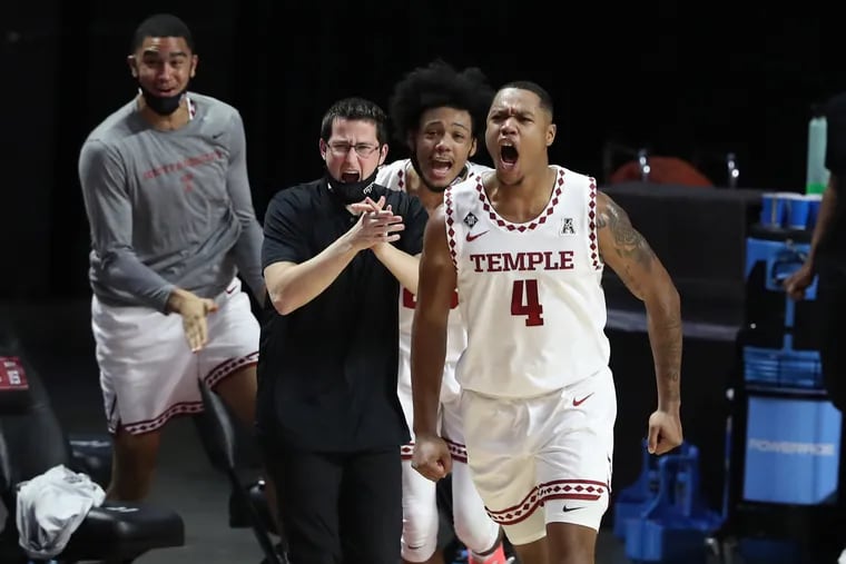 J.P. Moorman, right, and the Temple  celebrate as they pulled ahead of Central Florida during the 2nd half at the Liacouras Center on Jan. 14,, 2021.