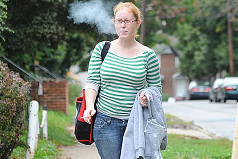 Roseann McNeill of Drexel Hill calls the ban 'ridiculous' - and unsafe for undergraduates who flee campus to smoke. (Clem Murray/Staff)