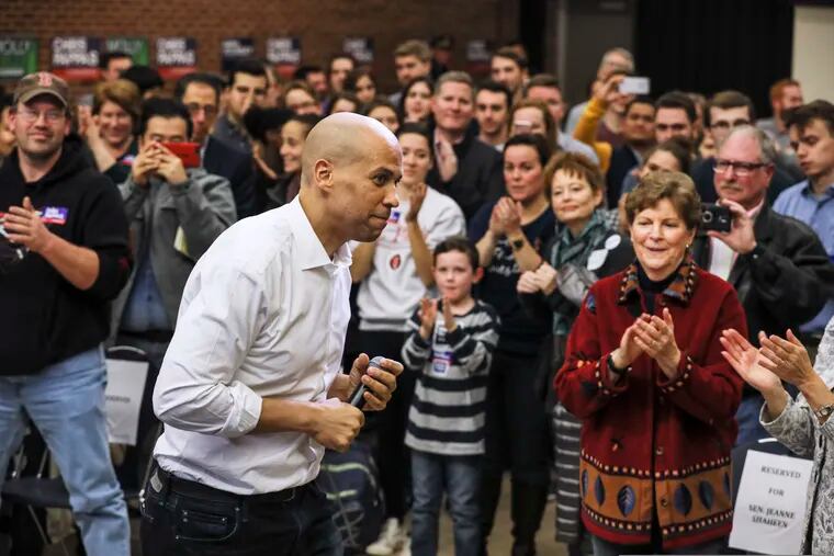 New Jersey Democratic Sen. Cory Booker exits the stage after speaking at a get out the vote event hosted by the NH Young Democrats  at the University of New Hampshire in Durham, N.H. Sunday, Oct. 28, 2018. (AP Photo/ Cheryl Senter)