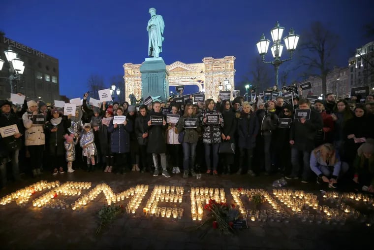 People in Moscow stand in front of the word “Kemerovo,” made up of candles to commemorate the victims of a fire in a shopping mall in the Siberian city of Kemerovo. Several Russian cities held rallies to commemorate the dead.