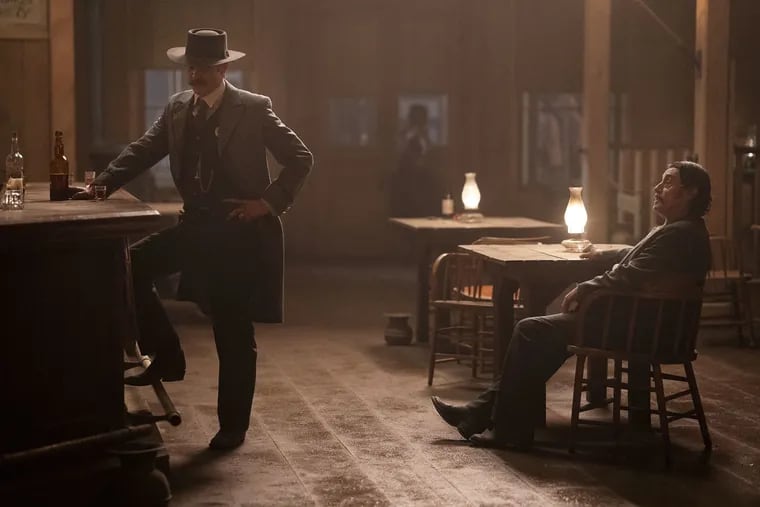 Timothy Olyphant (left) and Ian McShane in a scene from HBO's "Deadwood: The Movie," which premieres on Friday, May 31.