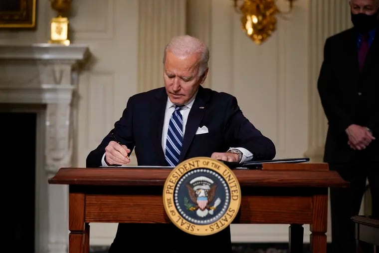 President Joe Biden signs an executive order on climate change.