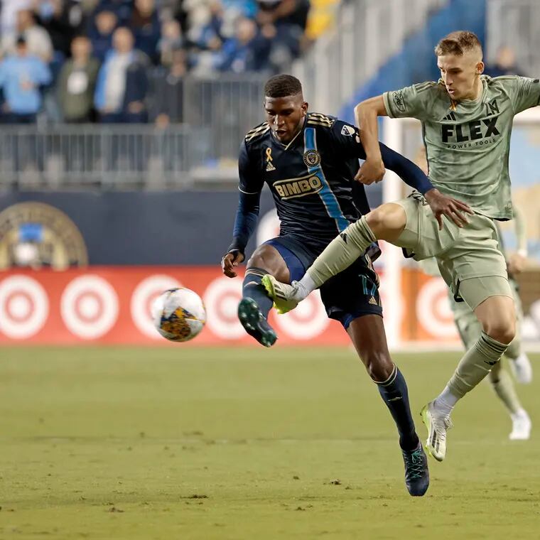 The Union's Damion Lowe (left) duels with LAFC's Stipe Biuk during the first half.