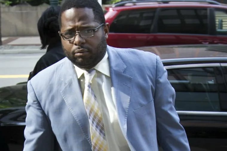Former Traffic Court Judge Willie Singletary enters court yesterday. He is one of seven facing trial in a ticket-fixing case.