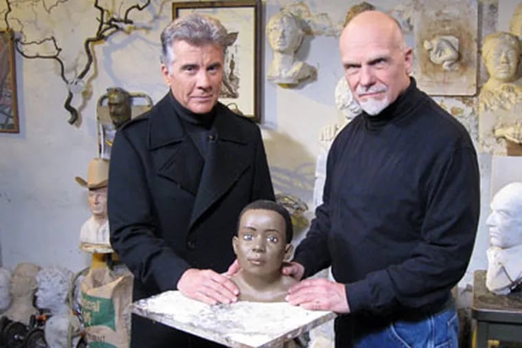 John Walsh (left), host of "America's Most Wanted," with Frank Bender, renowned forensic sculptor, in Bender’s studio/home on South Street this week. (Peter Mucha / Staff Photographer)