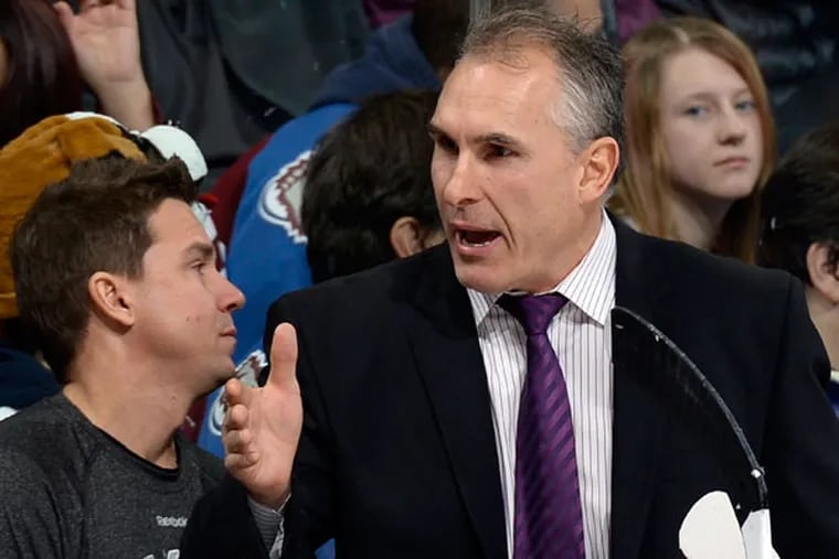 Craig Berube, right, yells during the second period of an NHL hockey game against the Colorado Avalanche, Thursday, Jan. 2, 2014, in Denver. (Jack Dempsey/AP)