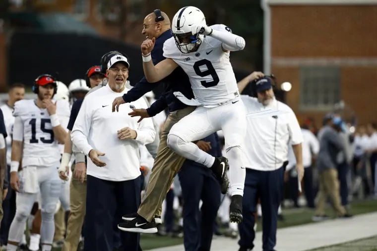 Penn State coach James Franklin and quarterback Trace McSorley celebrate TD pass.