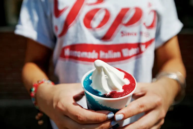 Ciarra Bianculli, a Pop's employee, shows off a red, white and blue water ice and ice cream combination they hope to serve during DNC week at Pop's Water Ice in Philadelphia, PA on July 16, 2016.