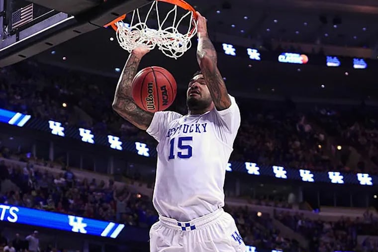 Kentucky Wildcats forward Willie Cauley-Stein (15) dunks the ball against the UCLA Bruins during the first half at United Center. (Mike DiNovo/USA Today)