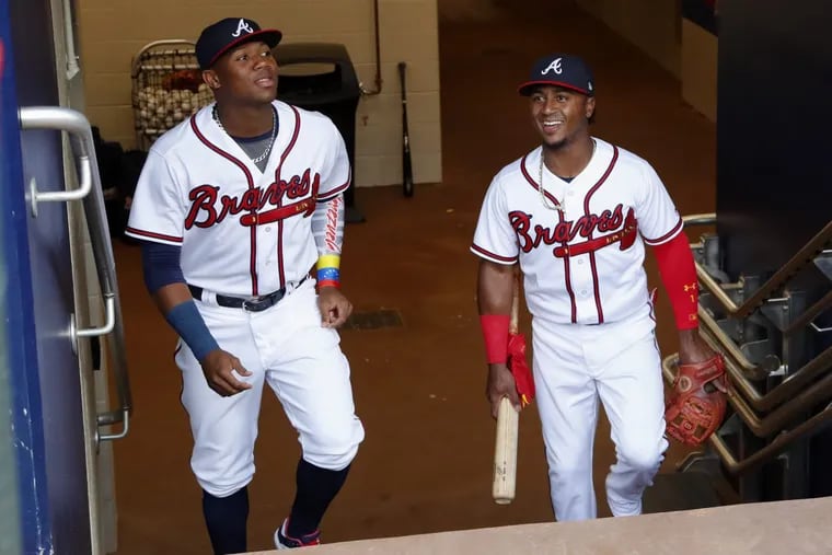 Rookie leftfielder Ronald Acuna Jr. (left) and second baseman Ozzie Albies are lead members of the young core that has the upstart Atlanta Braves in first place in the NL East.