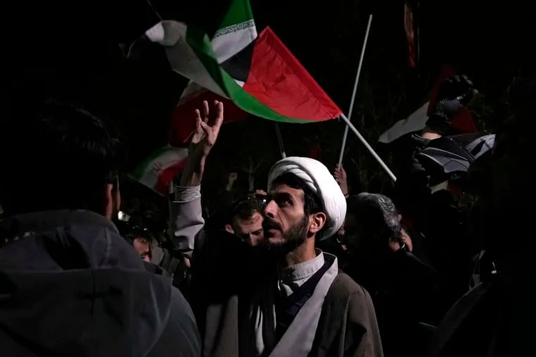 A cleric chants slogans during an anti-Israeli gathering in front of the British Embassy in Tehran, Iran, on Sunday, April 14, 2024. Iran launched its first direct military attack against Israel on Saturday.