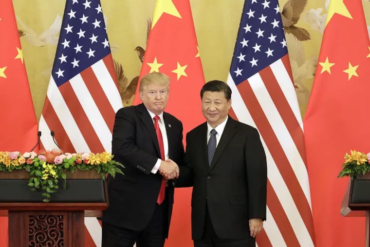 President Donald Trump, left, and Xi Jinping, China's president, shaking hands during a news conference at the Great Hall of the People in Beijing on Nov. 9, 2017.