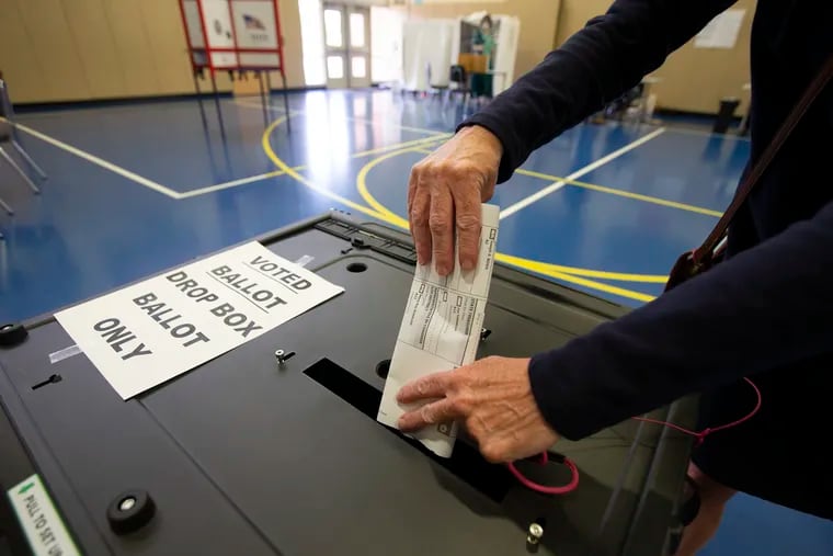 A paper ballot is cast at Nether Providence Elementary in Wallingford last year.
