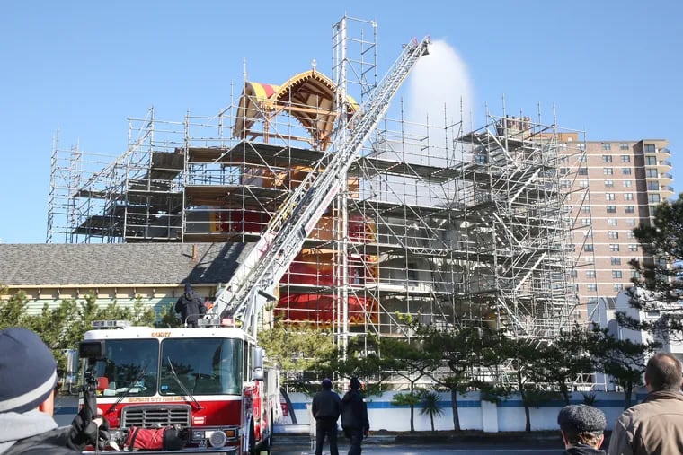 Lucy the Elephant, the six-story historic landmark, in Margate, N.J., gets a shower from the Margate City Fire Department, to check for leaks on the exterior of the attraction that is undergoing a restoration.