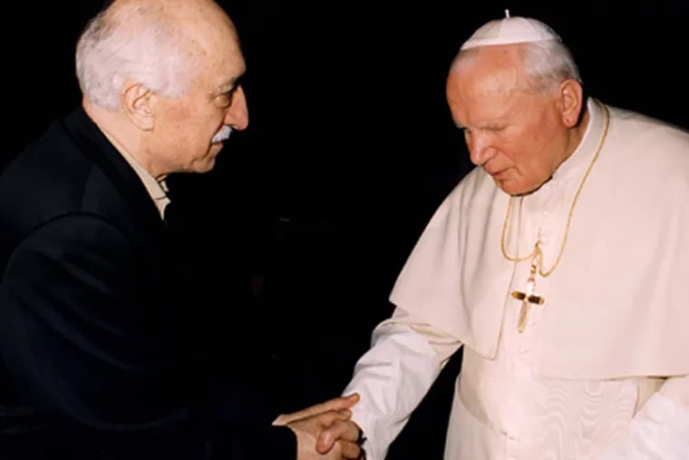 Fethullah Gulen and Pope John Paul II at the Vatican in 1998. Gulen, a major Islamic figure in Turkey, lives in the Poconos. He got a green card after touting educational leadership here. (Arturo Mari/AP)