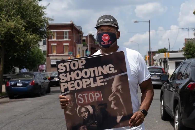 Jamal Johnson takes part in an anti-violence demonstration in the 1800 block of Susquehanna Avenue in North Philadelphia in July.