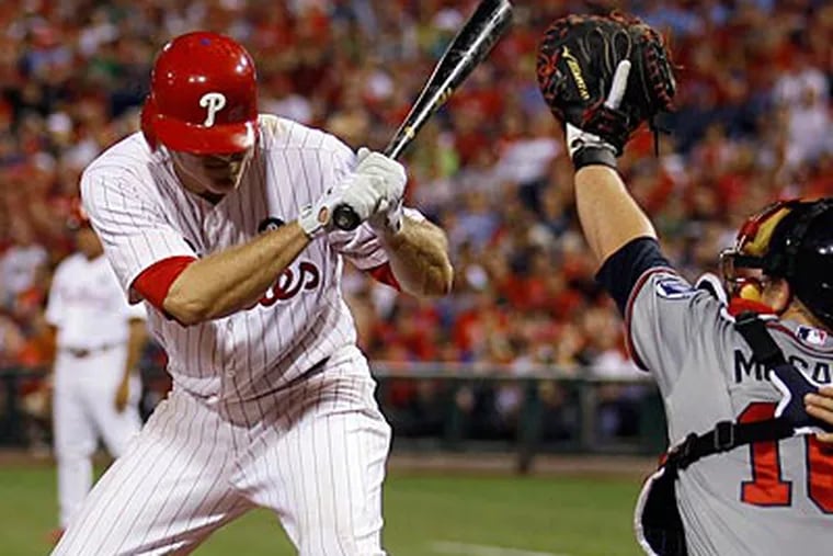 Chase Utley suffered a mild concussion after taking a pitch to the helmet on Wednesday. (Yong Kim/Staff Photographer)