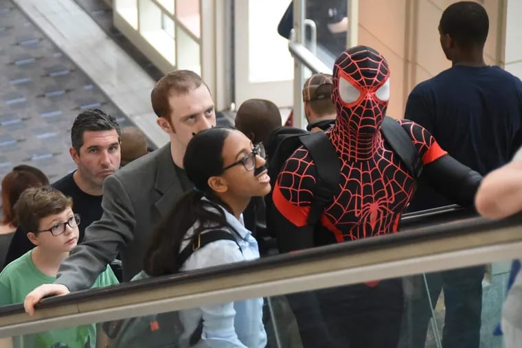 No web allowed, so like everyone else heading for  Wizard World at the Convention Center on Sunday, Spiderman had to take an escalator to get to the upper floors.