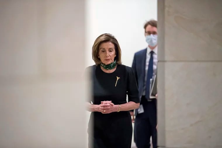 House Speaker Nancy Pelosi of Calif. arrives on Thursday for a news conference on Capitol Hill.