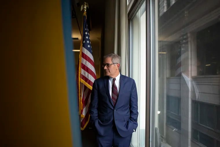 Philadelphia District Attorney Larry Krasner speaks with an aide while inside the DA's office in Center City, Philadelphia on Tuesday, June 18, 2019.