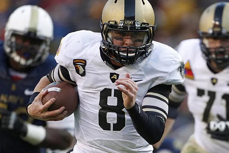 Army quarterback Trent Steelman (8) runs for a touchdown in the first
half of an NCAA college football game against Navy in Landover, Md.,
Saturday, Dec. 10, 2011. (AP Photo/Evan Vucci)